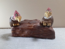A couple buzzards waiting around