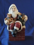 Santa sitting on the chimney